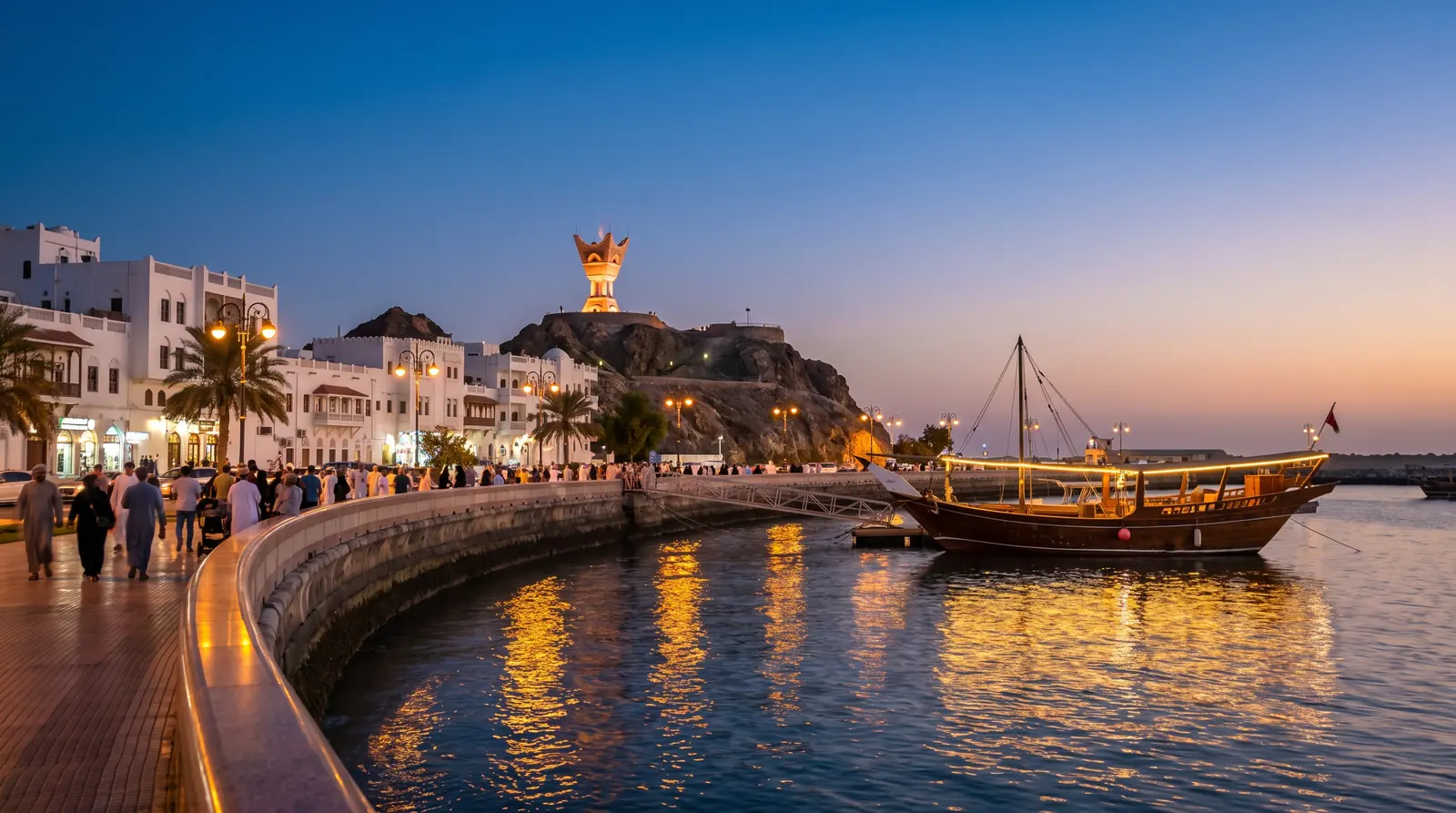 Muttrah Corniche at dusk with a traditional dhow